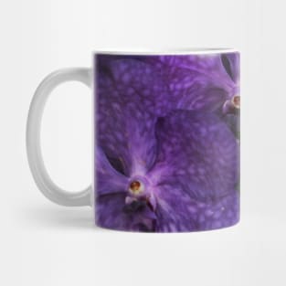Branch of purple orchids close-up Mug